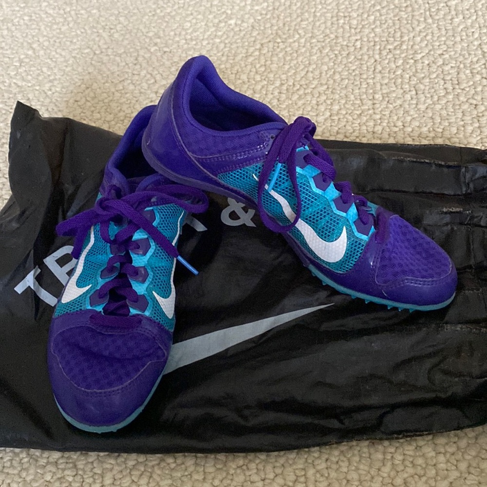 Nike track shoes with bag.  Size 7.5.  Excellent condition.